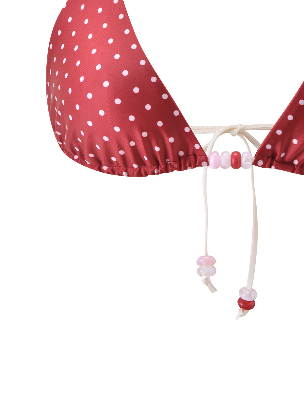 Close-up of the TIGERMIST FINLEA BIKINI TOP in red and cream polka dot, featuring a halter neck with white drawstrings, pink, white, and red beads, shown against a plain white background.