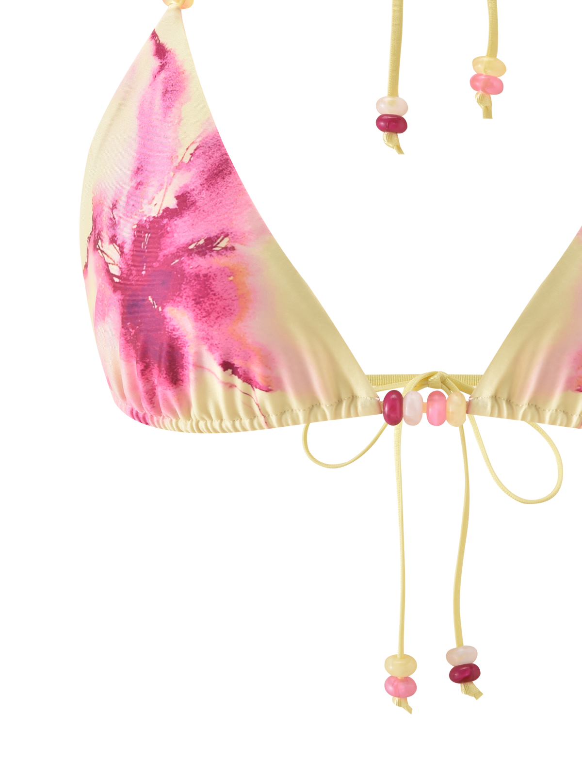 Close-up of the TIGERMIST FINLEA BIKINI TOP - WATERCOLOUR FLORAL, a triangle bikini top with a pink and yellow tie-dye look, adjustable halter neck, thin yellow straps, and beads in pink, yellow, and peach tones.