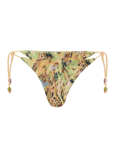 The FINLEA BIKINI BOTTOM - ANIMAL SWIRL by TIGERMIST features a multicolored abstract animal print and yellow beaded side ties.