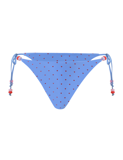 The TIGERMIST FINLEA BIKINI BOTTOM - BLUE HEART POLKA DOT features a cheeky cut and playful blue heart polka dots for a fun swim look.