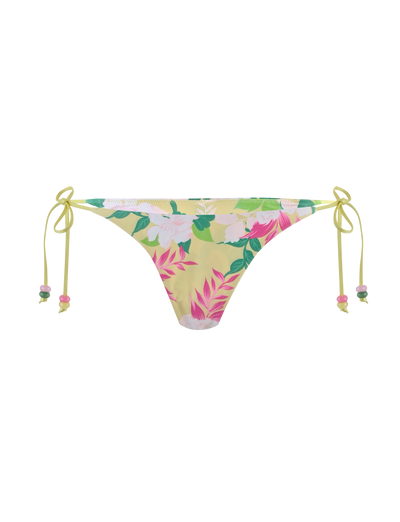 The FINLEA BIKINI BOTTOM - PAISLEY BORDER by TIGERMIST features a cheeky cut, pink and white floral print on yellow elastane fabric, and adjustable side ties finished with yellow bows.