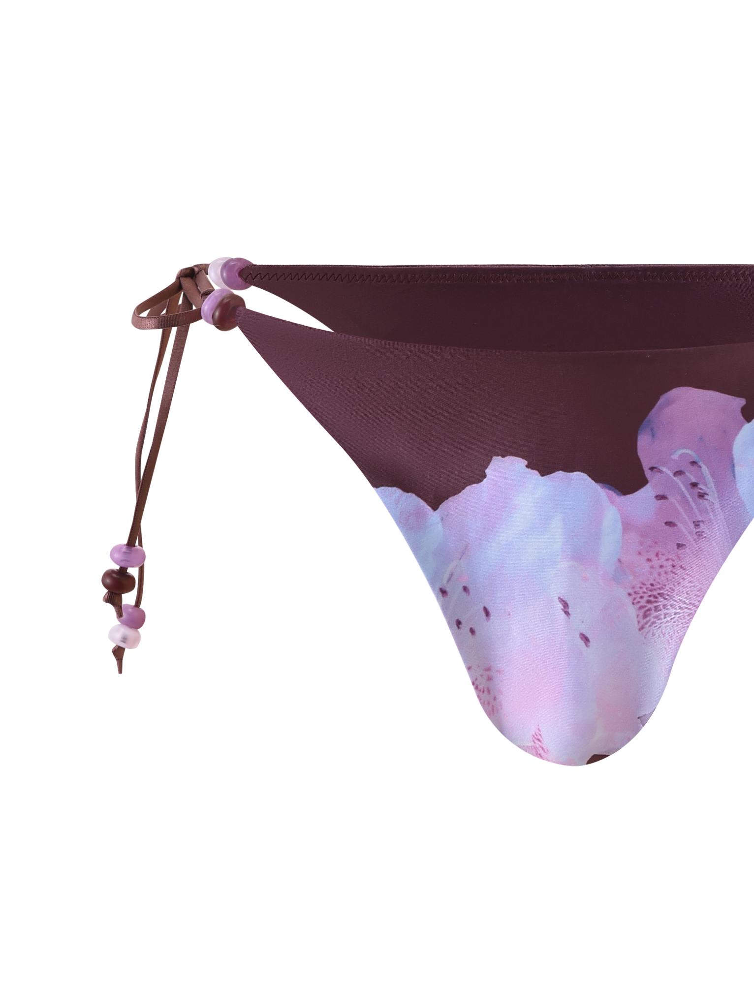 Close-up of FINLEA BIKINI BOTTOM - ZEN FLORAL by TIGERMIST, featuring a maroon waistband, beaded straps with pink and purple beads, and a light pink and lavender floral print on a white background.
