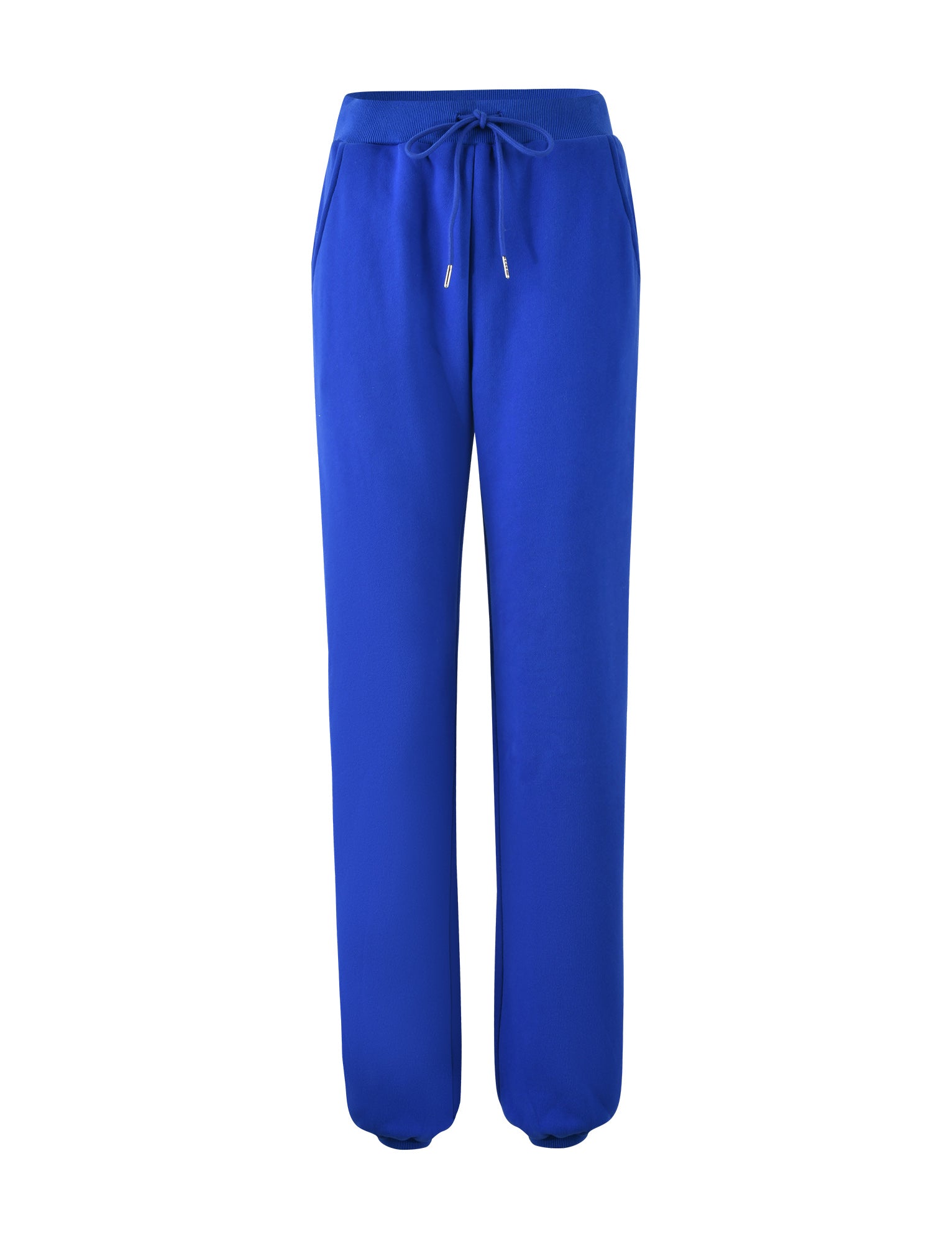 The LUMEN PANT - BLUE by TIGERMIST is a pair of bright blue sweatpants with an adjustable drawstring waist. Featuring two side pockets and designed with elastic cuffs at the ankles, the material appears soft and comfortable, making it suitable for casual or athletic wear. The background is plain white.