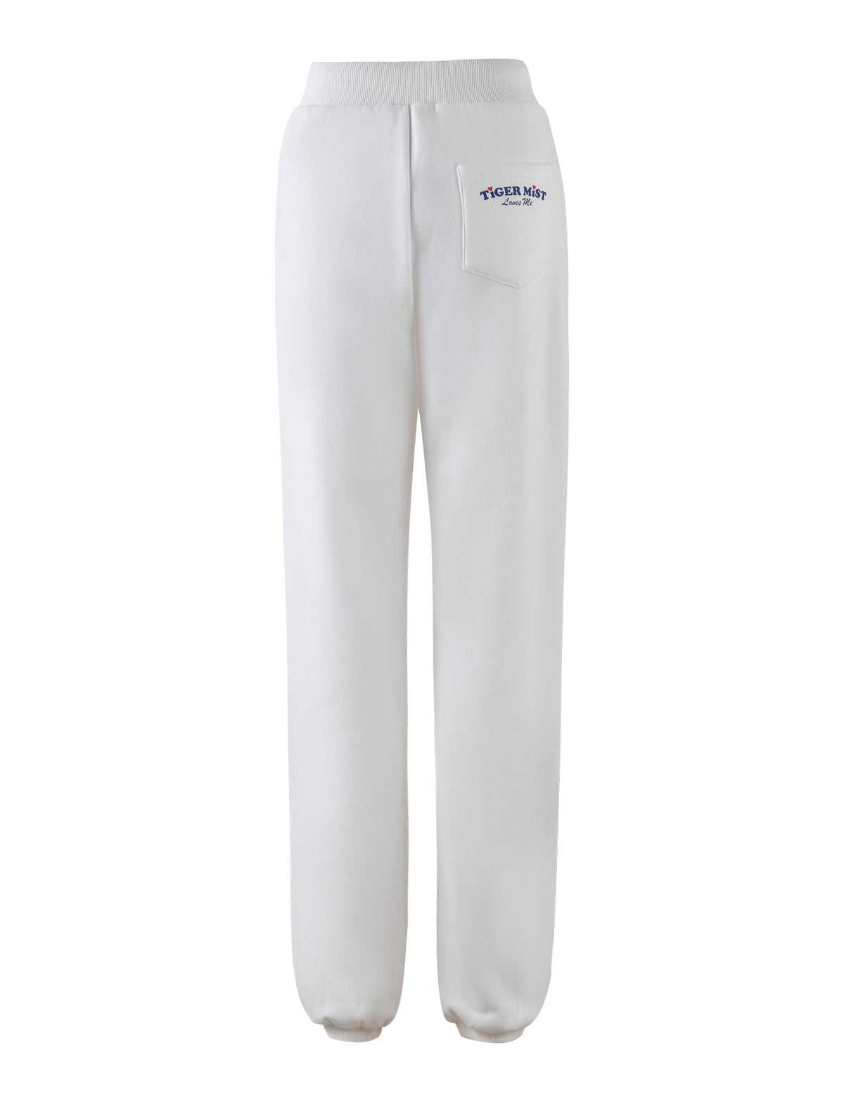 The LUMEN PANT - WHITE from TIGERMIST features a mid-rise with an elastic waistband and elastic cuffs at the ankles. Shown from the back, these pants have a small pocket on the right side near the waistband adorned with a logo and text in blue that reads "TIGERMIST" and underneath it, "Since 2007".