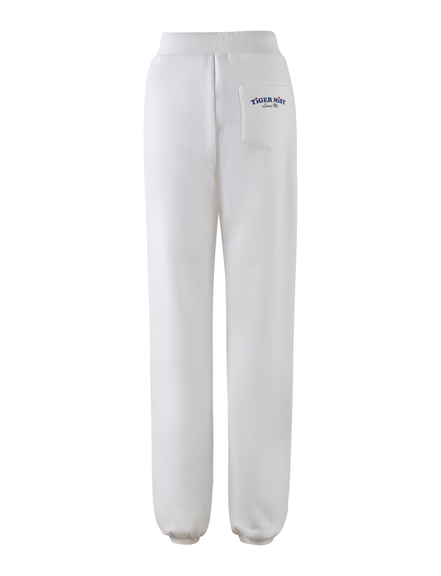 The LUMEN PANT - WHITE from TIGERMIST features a mid-rise with an elastic waistband and elastic cuffs at the ankles. Shown from the back, these pants have a small pocket on the right side near the waistband adorned with a logo and text in blue that reads "TIGERMIST" and underneath it, "Since 2007".