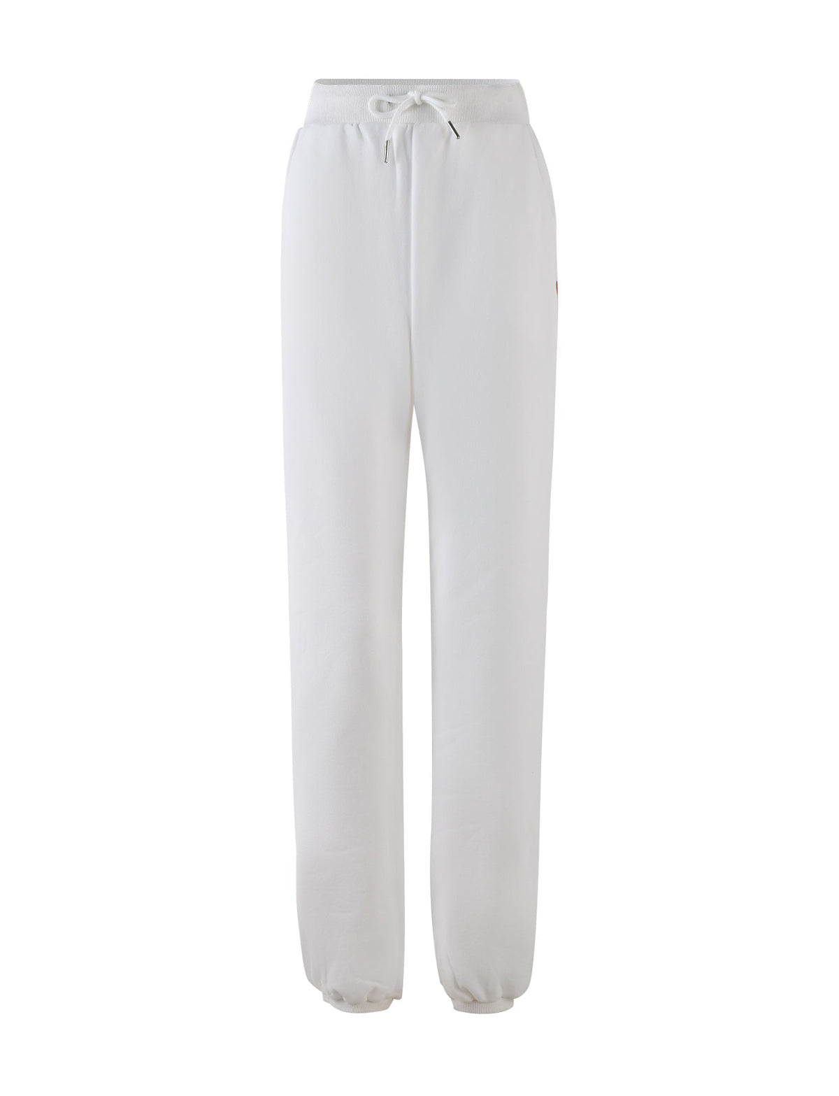 The LUMEN PANT in white by TIGERMIST is a pair of mid-rise loungewear pants featuring an elastic waistband and drawstring tie. These sweatpants offer a relaxed fit with tapered legs and elastic cuffs at the ankles, creating an oversized trackpant silhouette. They also include subtle seam pockets on each side.