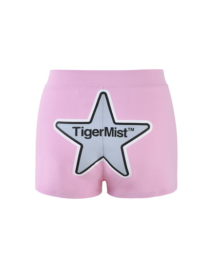 Low-rise waist pink DELANEY SHORT from TIGERMIST, featuring a large white star with a black outline and the text "TigerMist™" on the back.