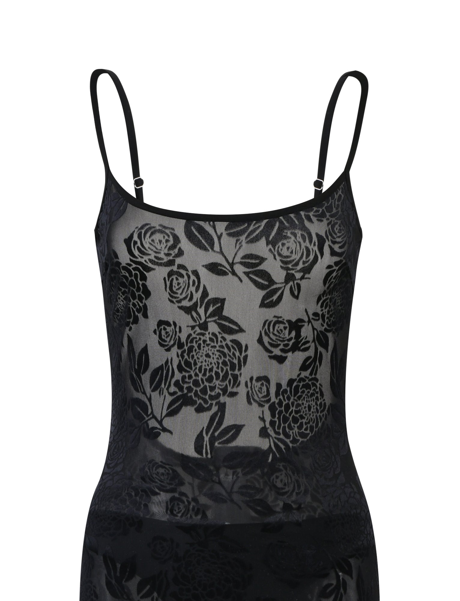 A black, sheer, floral-patterned spaghetti strap dress from Tiger Mist, named the Zuzanna Dress - Black Burnout, is shown. The fabric features an intricate design of roses with leaves. The white background highlights the delicate and see-through quality of the material.