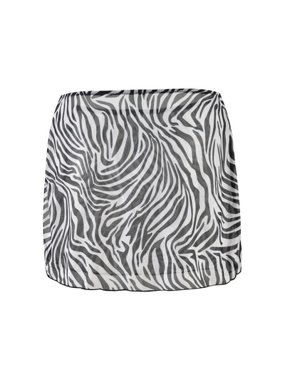 The CYNTHIA MINI MESH SKIRT from TIGERMIST features a zebra print design, showcasing black and white wavy stripes that mimic a zebra's pattern. This form-fitting skirt is made from lightweight mesh material, offering both style and comfort.