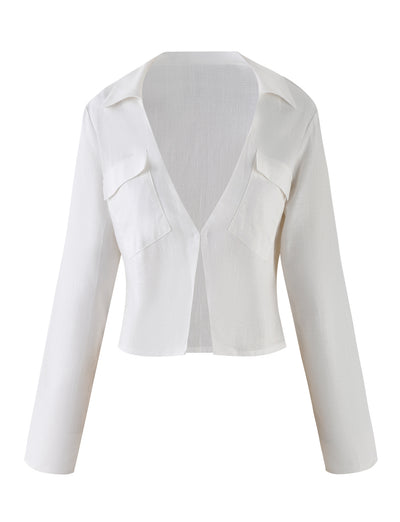 The AIDEN TOP from TIGERMIST is a chic, white, long-sleeve open-front blouse that features two chest pockets. Designed with a collar and made from lightweight, semi-transparent fabric, it exudes a relaxed yet elegant style. Its minimalist design is accentuated by the absence of buttons or fasteners.