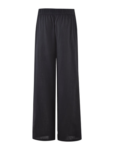 A pair of AIDEN PANT - BLACK from TIGERMIST, displayed on a plain white background. These wide-leg pants feature an elastic waistband and offer a loose, comfortable fit with a simple, minimalist design.