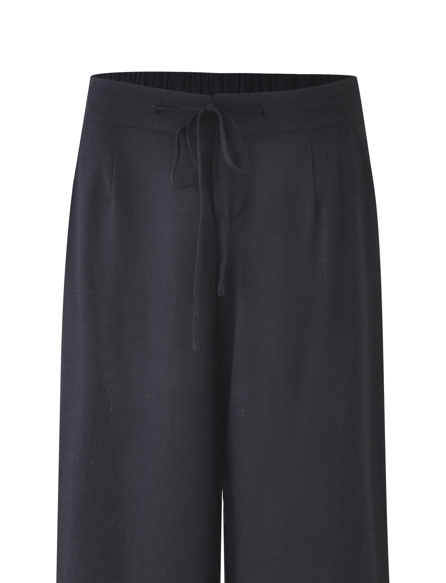 The AIDEN PANT - BLACK from TIGERMIST is displayed. The drawstring is tied in a bow at the center front, and the pants offer a relaxed fit with straight legs. The material seems soft and comfortable, ideal for casual wear. The background is white, showcasing the pants fully.