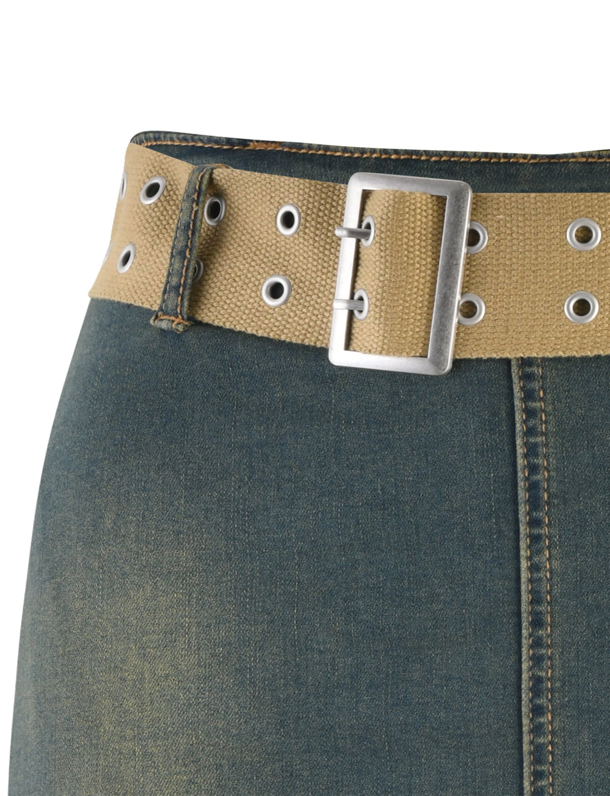 Close-up of the ISABEL SKORT from TIGERMIST in denim blue, showcasing yellowish-brown stitching and a beige webbed belt with metal eyelets and a silver rectangular buckle. The slightly faded fabric gives it a casual, worn-in look.