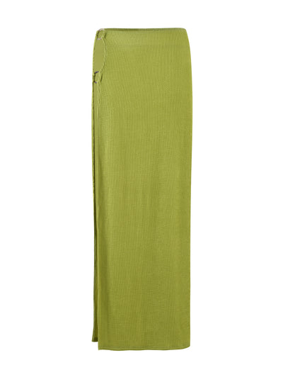 Introducing the NEERA MAXI SKIRT - LIME GREEN by TIGERMIST, a long knit skirt in an olive green hue. It features a ribbed texture, a side slit, and a decorative ring detail at the waist. Designed with a straight, streamlined silhouette, this skirt extends to ankle length.