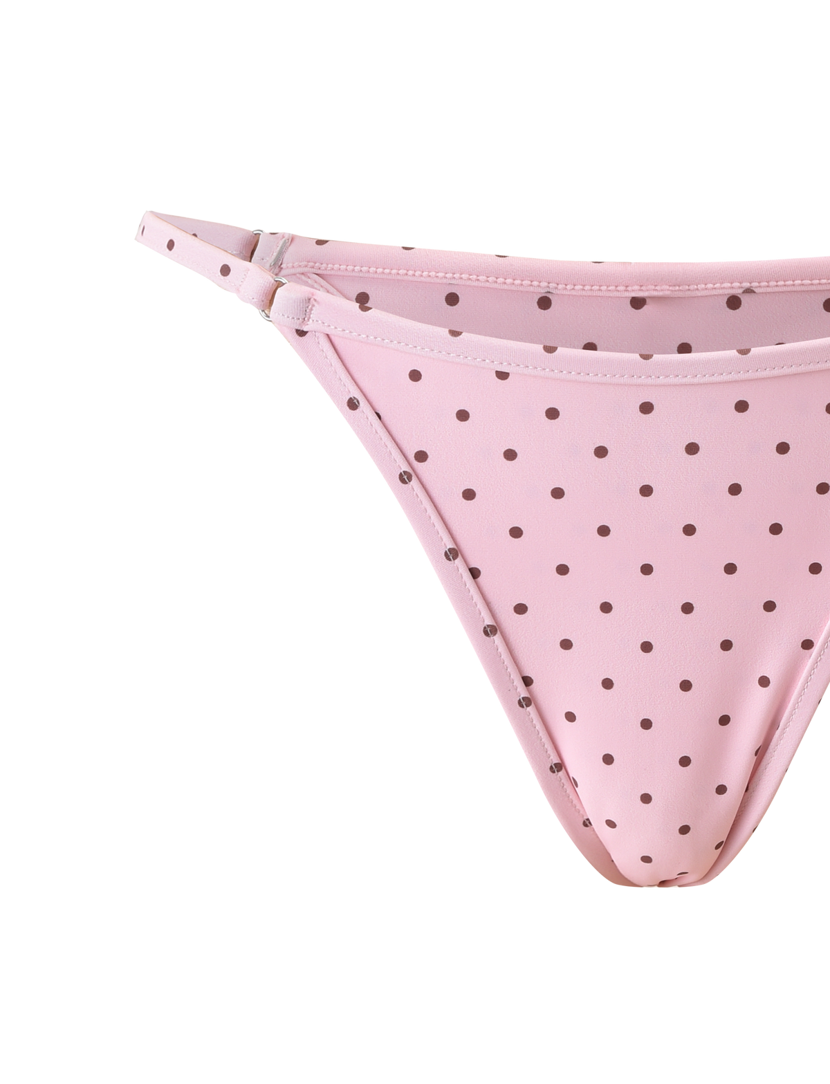 A close-up of the TIGERMIST DIANA SWIM SKIRT SET in pink polka dot, featuring brown spots and thin side straps, displayed on a white background.
