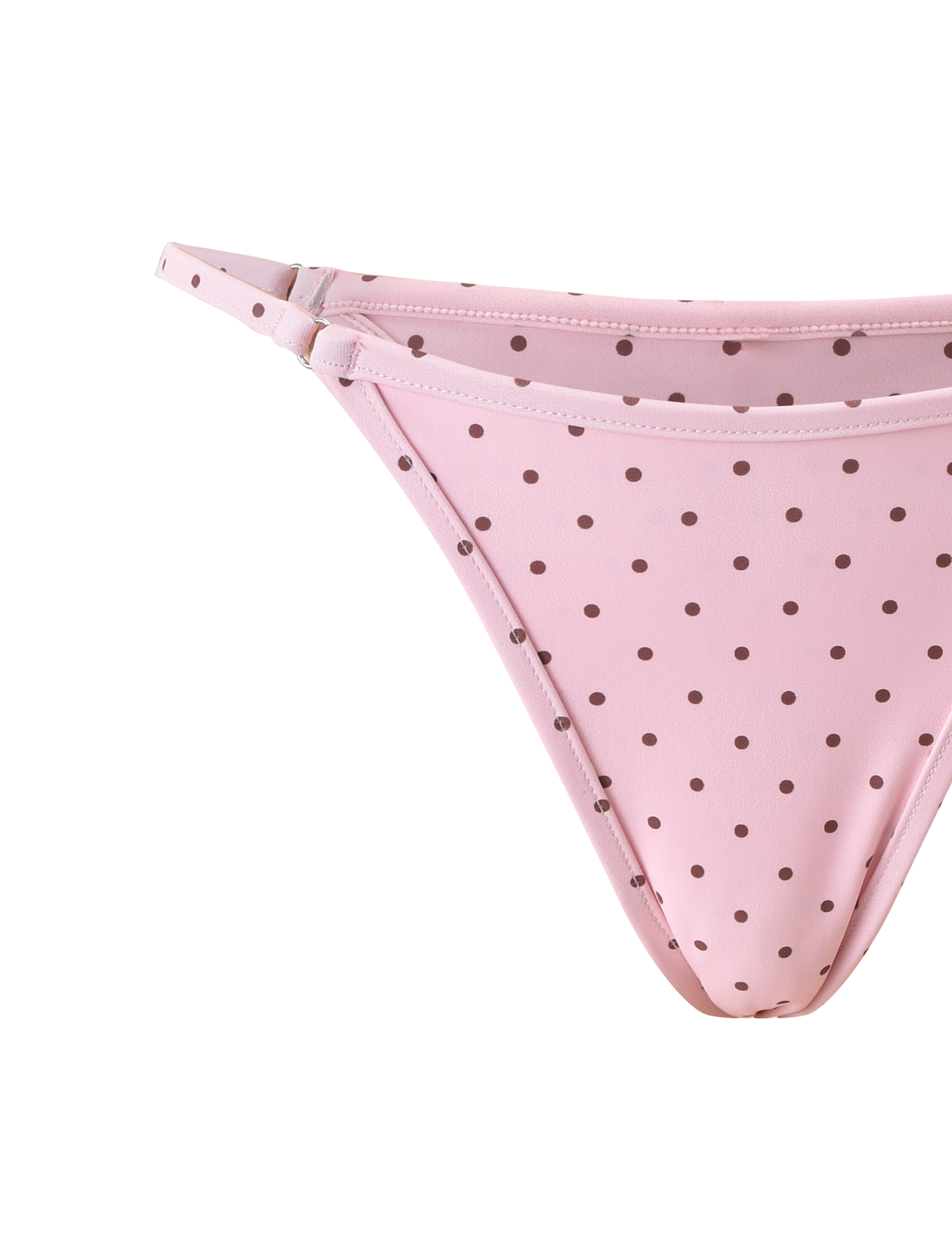 A close-up of the TIGERMIST DIANA SWIM SKIRT SET in pink polka dot, featuring brown spots and thin side straps, displayed on a white background.