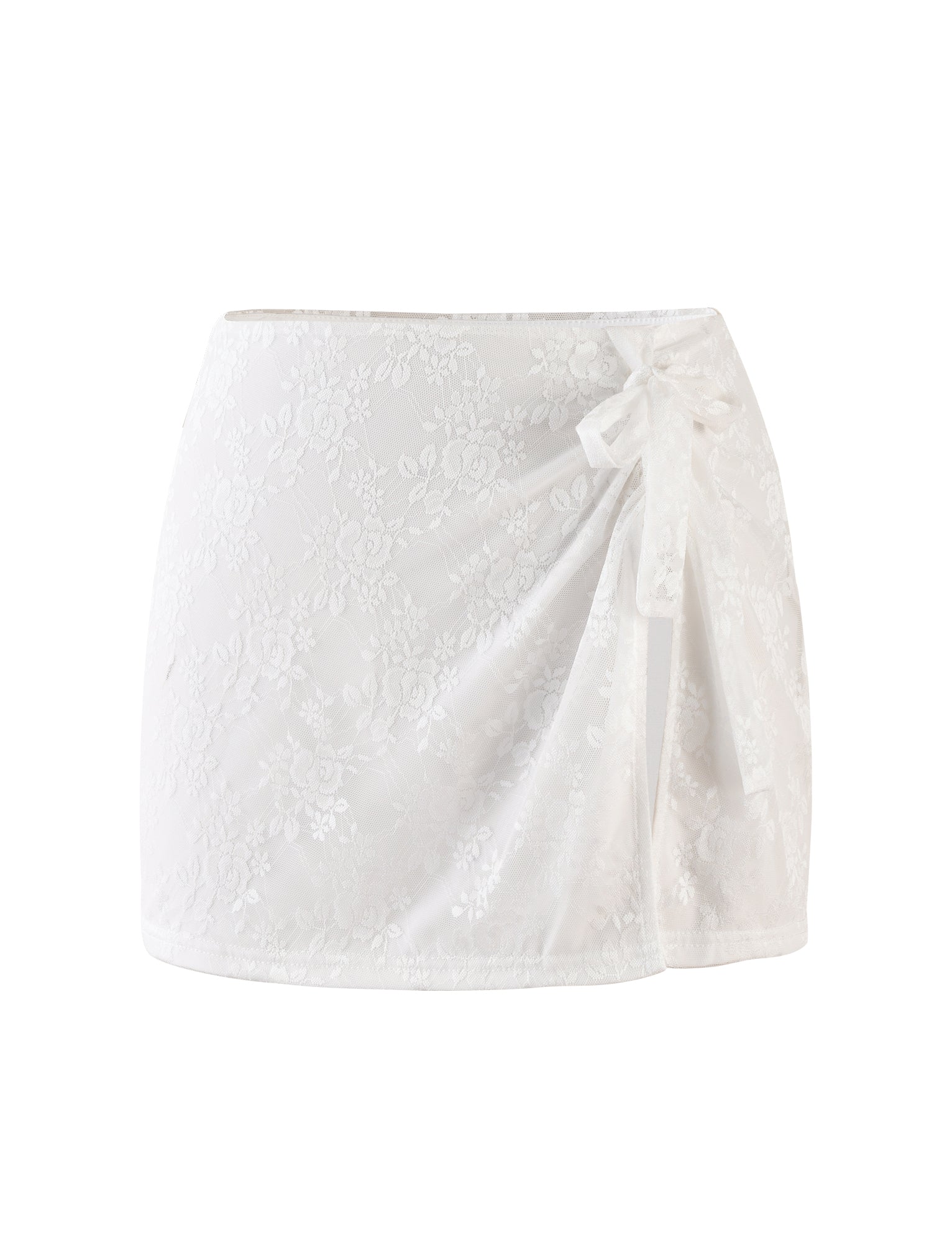 The FLORIAN SKIRT - WHITE : LACE by TIGERMIST is a white lace mini skirt that boasts a draped design and features a decorative bow on the right side. The delicate, textured pattern elegantly covers the entire A-line silhouette, while the bow adds an elegant touch to this feminine garment.