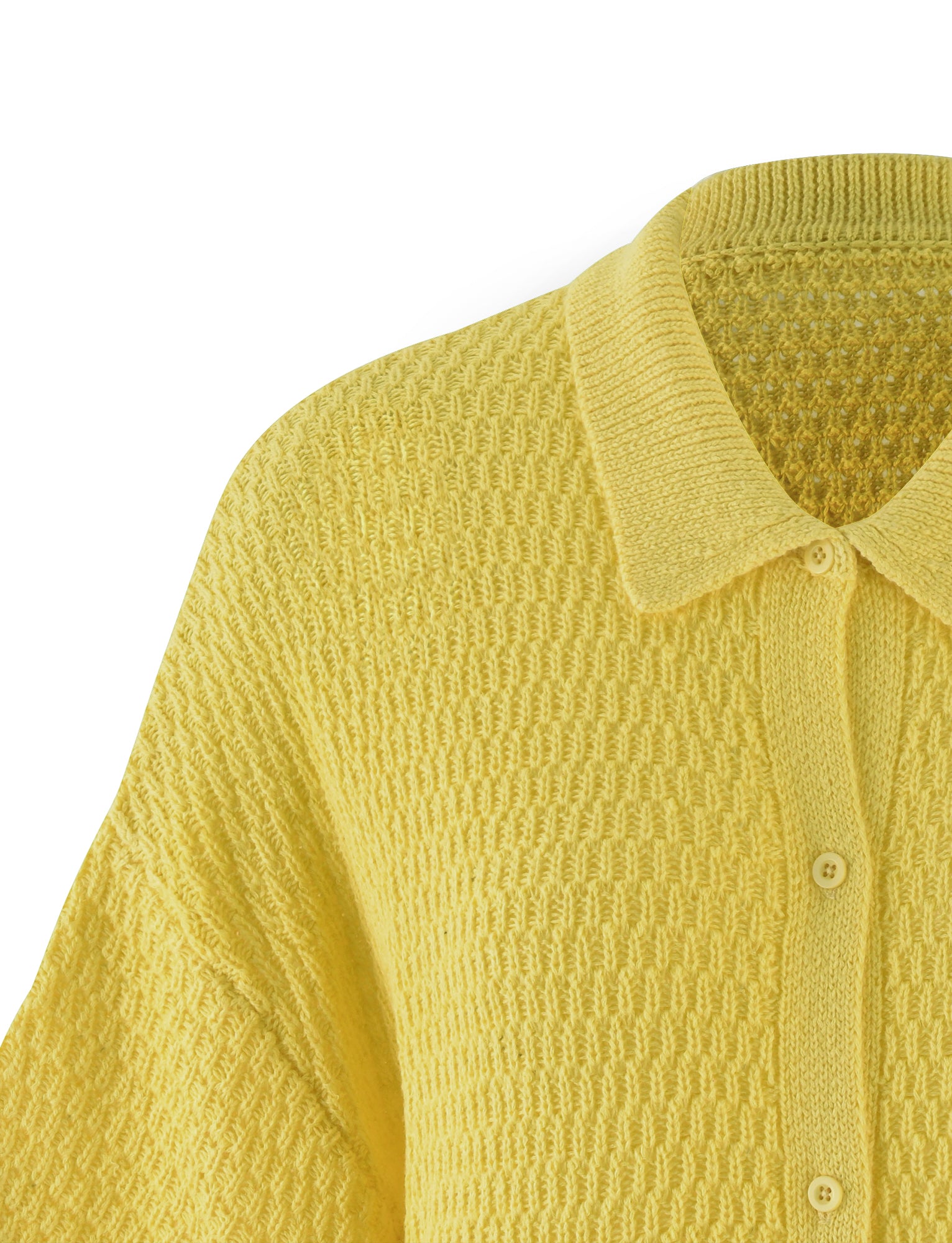 A close-up of the JANAI TOP - YELLOW : LEMON from TIGERMIST featuring a textured pattern and a collared neckline. The top has button-down detailing with three buttons visible in the image. The fabric appears cozy and soft, making it ideal for cooler weather.