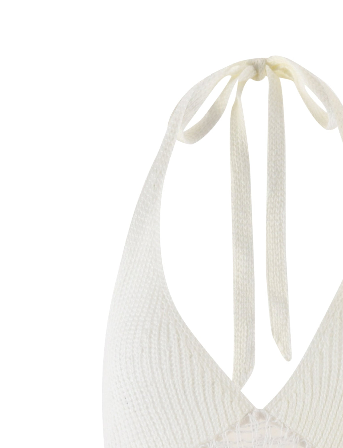 Close-up of the halter neck tie-back on the ARDEEN DRESS - WHITE from TIGERMIST. The fabric, slightly ribbed, showcases neatly falling tie strands over a V-shaped neckline that reveals the intricate knit pattern below. The background is plain white.