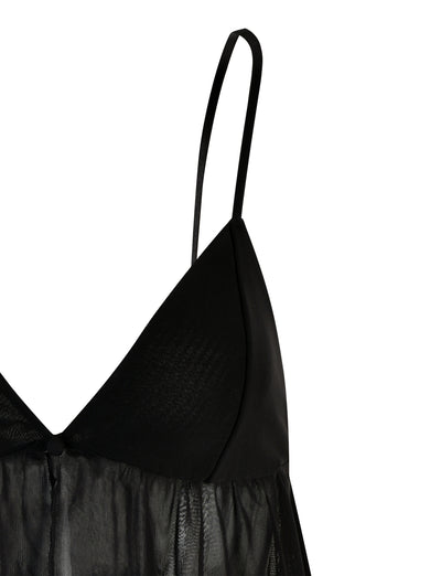 A close-up image of the SINGE TOP - BLACK by TIGERMIST showcases its elegant design. This black lingerie top features spaghetti straps and is made with semi-sheer fabric, revealing a delicate texture. The bodice has a smooth, opaque triangular section that seamlessly transitions into a slightly transparent lower portion.