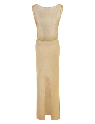 The ZAELA DRESS - GOLD by TIGERMIST is a stunning sleeveless long dress featuring a fitted waist and subtle sheen. The dress boasts a scooped neckline and a high slit in the front, extending from the hem to above the knee. Made from lightweight, semi-sheer fabric, this piece offers both elegance and style.