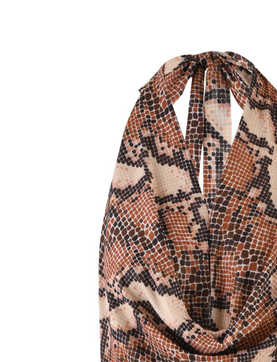 A close-up image of the TigerMist Catalina Dress in a brown snakeskin print. The dress showcases a pattern resembling snake scales with shades of brown, black, and beige. It features a sleeveless design with a halter neckline that gathers and ties at the back of the neck.