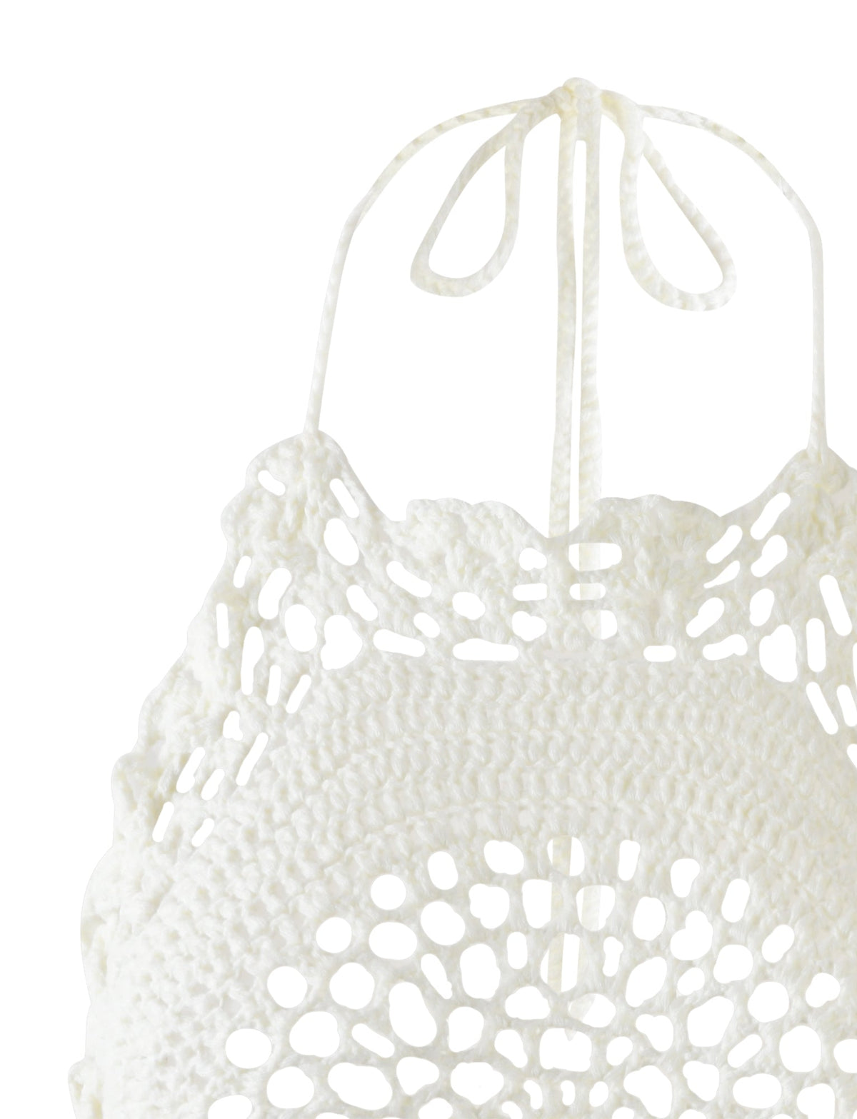 Close-up of the Maceline Dress in white from TIGERMIST. This dress features intricate crocheted patterns, showcasing an open floral-like motif crafted with delicate crochet threads, and it ties into a bow at the neck. The detailed and delicate crochet work highlights its exquisite craftsmanship.