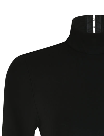 A close-up view of the AKARI BODYSUIT in black from TIGERMIST, showcasing a zipper detail at the back of the neck. The fabric looks smooth and slightly stretchy, with part of the shoulder and upper sleeve visible.