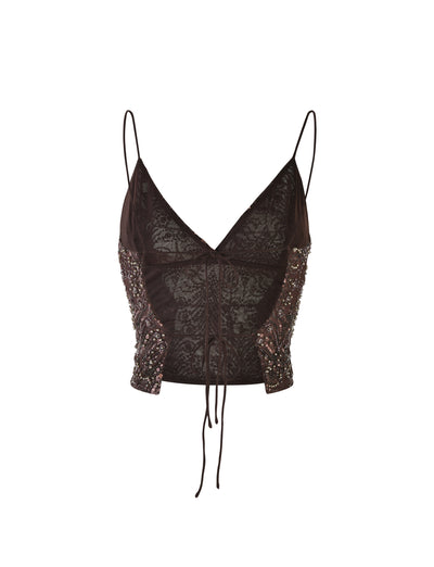 A delicate lace RAINA TOP in chocolate brown from TIGERMIST, featuring thin spaghetti straps, intricate beading on the sides, a V-neckline, and two thin strings hanging down from the center.