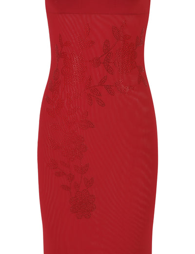 A close-up of the TIGERMIST Octavia Maxi Dress - Red in Cherry Red reveals a maxi-length design, featuring intricate floral lace detailing across the midsection, creating an elegant and stylish pattern.