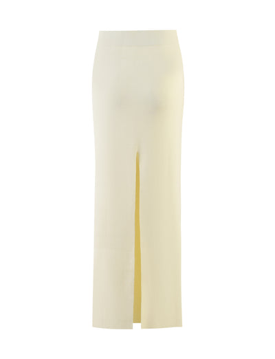 A cream-colored, high-waisted LEDGER SKIRT from TIGERMIST, featuring a front center slit and extending below the knee, photographed against a plain white background.
