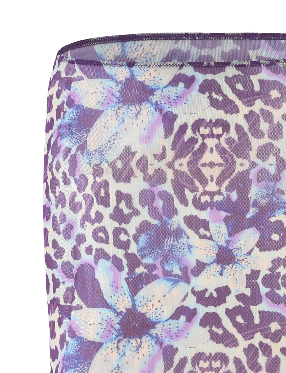 Close-up of the KELLAN SKIRT - PURPLE : BY POPPY LEOPARD from TIGERMIST, showcasing a fabric pattern with a blend of purple leopard spots and light blue orchids accented with purple. The sheer material slightly reveals the background, with a noticeable fold at the top edge.