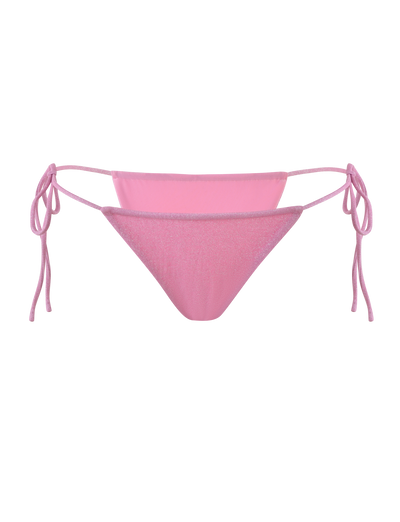 The TIGERMIST ELLISON BIKINI BOTTOM in baby pink features luxe shimmer lurex fabric, adjustable side ties, and a cheeky cut, shown on a plain light pink background.