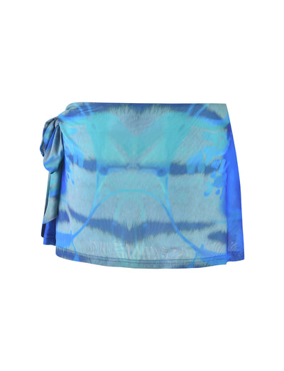 The TINSLEY SKORT - MULTI : ABSTRACT TIE DYE from TIGERMIST, tied at the waist, showcases a vibrant blue and green wavy pattern on a smooth, lightweight fabric. Featuring a short hemline and flowy, casual style, it's ideal for beach outings or sunny days.