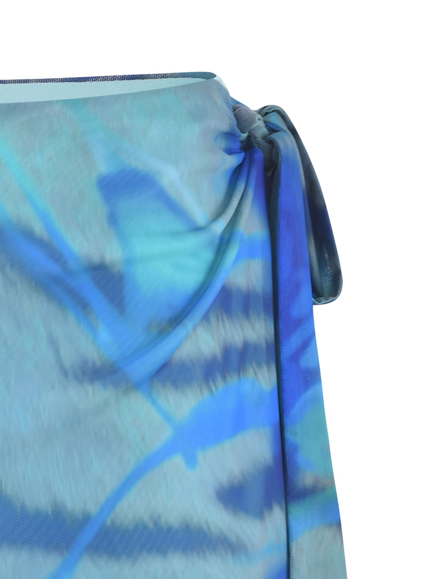 A close-up image of the TINSLEY SKORT - MULTI : ABSTRACT TIE DYE from TIGERMIST features a tie detail on the right. The fabric displays a gradient pattern with varying shades of blue, giving it a lightweight and sheer appearance.