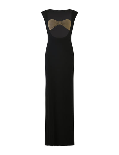 The BLAKELY DRESS - BLACK by TIGERMIST is a full-length, sleeveless black evening gown featuring a semi-sheer black mesh panel with a gold bow detail at the chest, creating an elegant and sophisticated look. The dress has a fitted silhouette and a simple, sleek design.