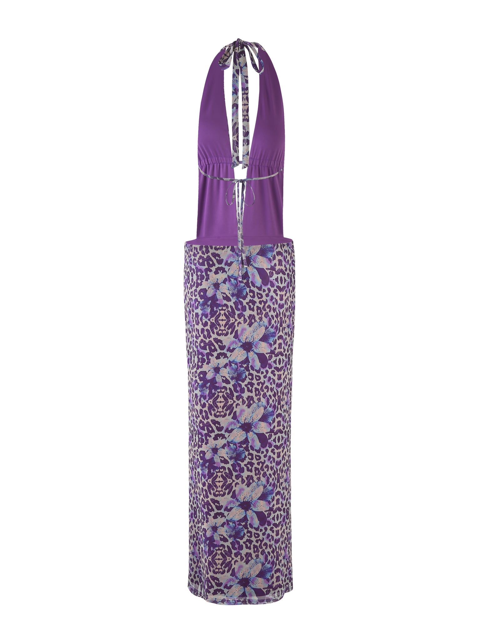 The MAGDALENA MAXI DRESS - PURPLE by TIGERMIST, designed by Poppy Leopard, is a stunning halter-neck dress featuring a plunging neckline and keyhole detail. This dress showcases a fitted bodice and a long, straight skirt embellished with floral and abstract patterns in shades of purple, blue, and white.