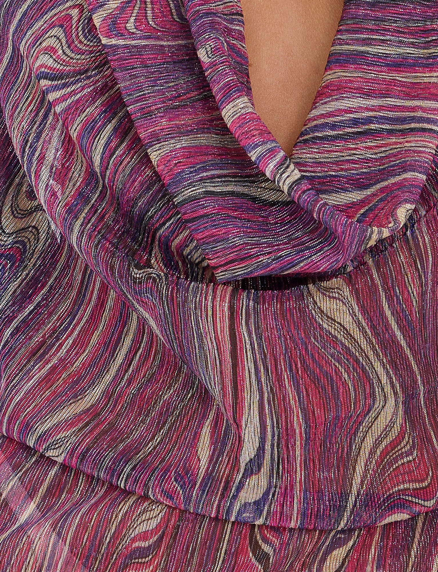Close-up of the SONORA DRESS - MULTI : ROSE STRIPE from TIGERMIST, featuring an abstract, wavy pattern in shades of pink, purple, beige, and black. The fabric appears soft and slightly sheer with a gathered or draped appearance.
