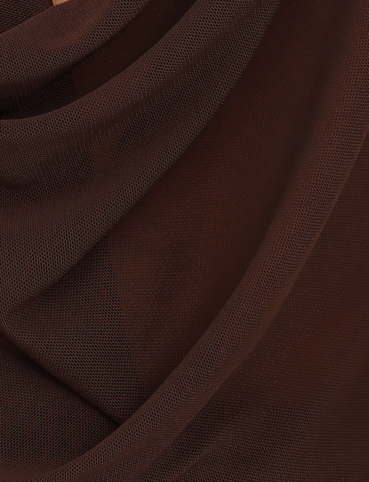 Close-up of chocolate brown mesh fabric draped in soft folds, highlighting the textured, semi-transparent look of the TIGERMIST MAKENA TWO-PIECE TOP - BROWN : CHOCOLATE.