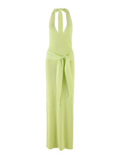 The MAREE DRESS - GREEN by TIGERMIST is a light green knit halter-neck dress featuring a plunging neckline and a large matching sash tied in a bow at the waist. This maxi-length dress boasts a sleek, fitted design that exudes elegance and modernity.