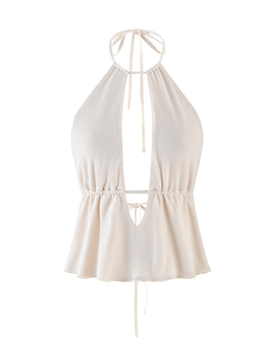 The BIRDEE TOP - WHITE : CREAM by TIGERMIST is a sleeveless halter top featuring a deep V-neckline and neck ties. It boasts a gathered, cinched waist and a slightly flared hem, crafted from soft and flowy fabric in light beige.