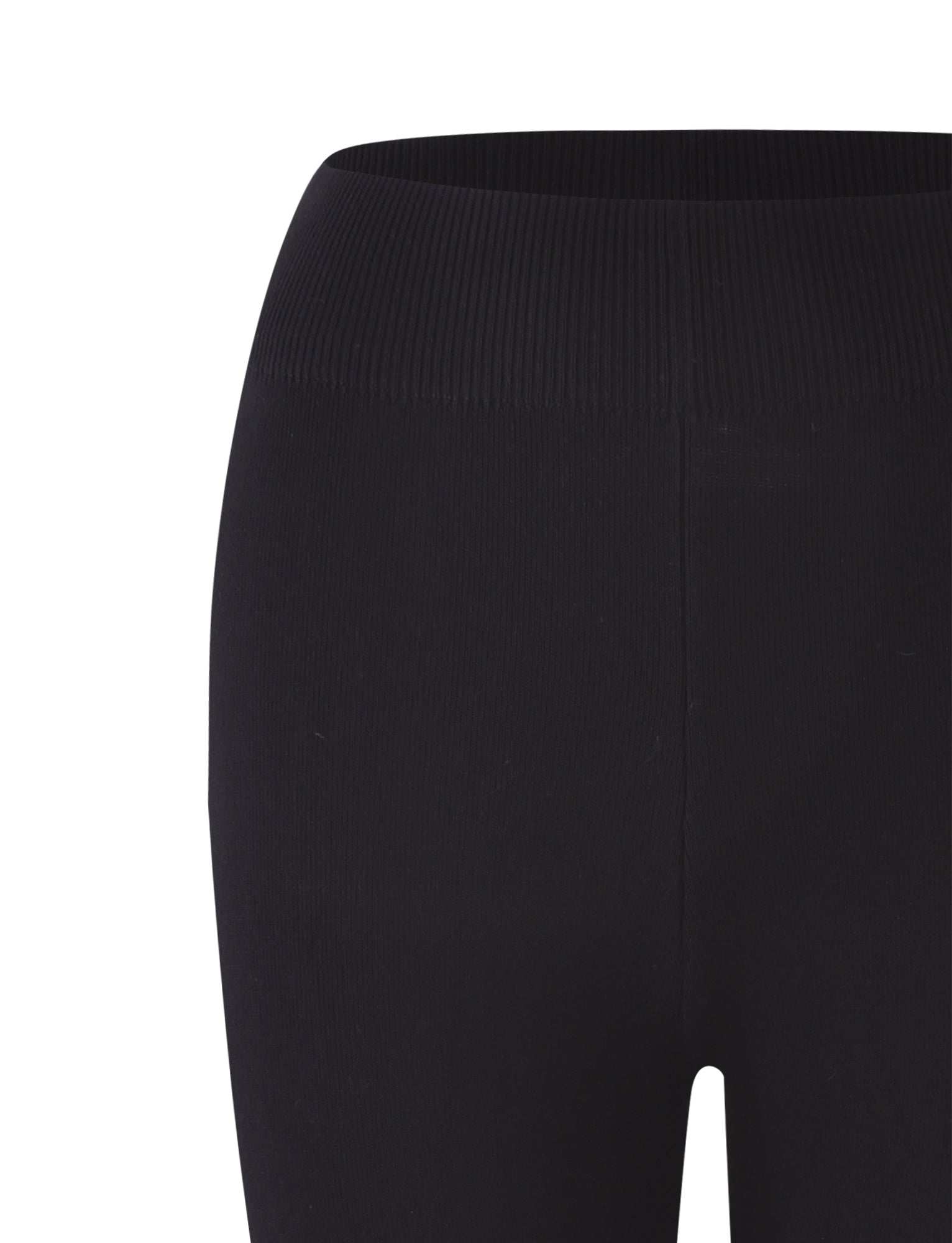 A close-up view of the upper part of a pair of TIGERMIST LEDGER CAPRI leggings in black. The high-rise waistband and smooth, stretchy fabric are prominently displayed, highlighting their bodycon fit around the top section of one leg.