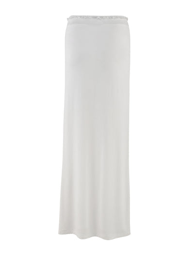 The BENTON SKIRT - WHITE by TIGERMIST is a white maxi skirt with a straight, minimalist design. This skirt boasts a smooth and seamless appearance, extending to ankle length, and features a simple lace waistband. Crafted from lightweight fabric, it is perfect for both casual and formal occasions.