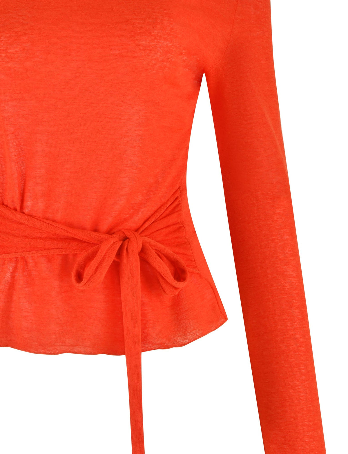 A close-up view of the BRYNA Jumper in red from TIGERMIST, showcasing its long-sleeve design with a tied waist detail. The knit fabrication looks soft and slightly sheer. The bow tie accentuates the fitted silhouette, adding a stylish touch.