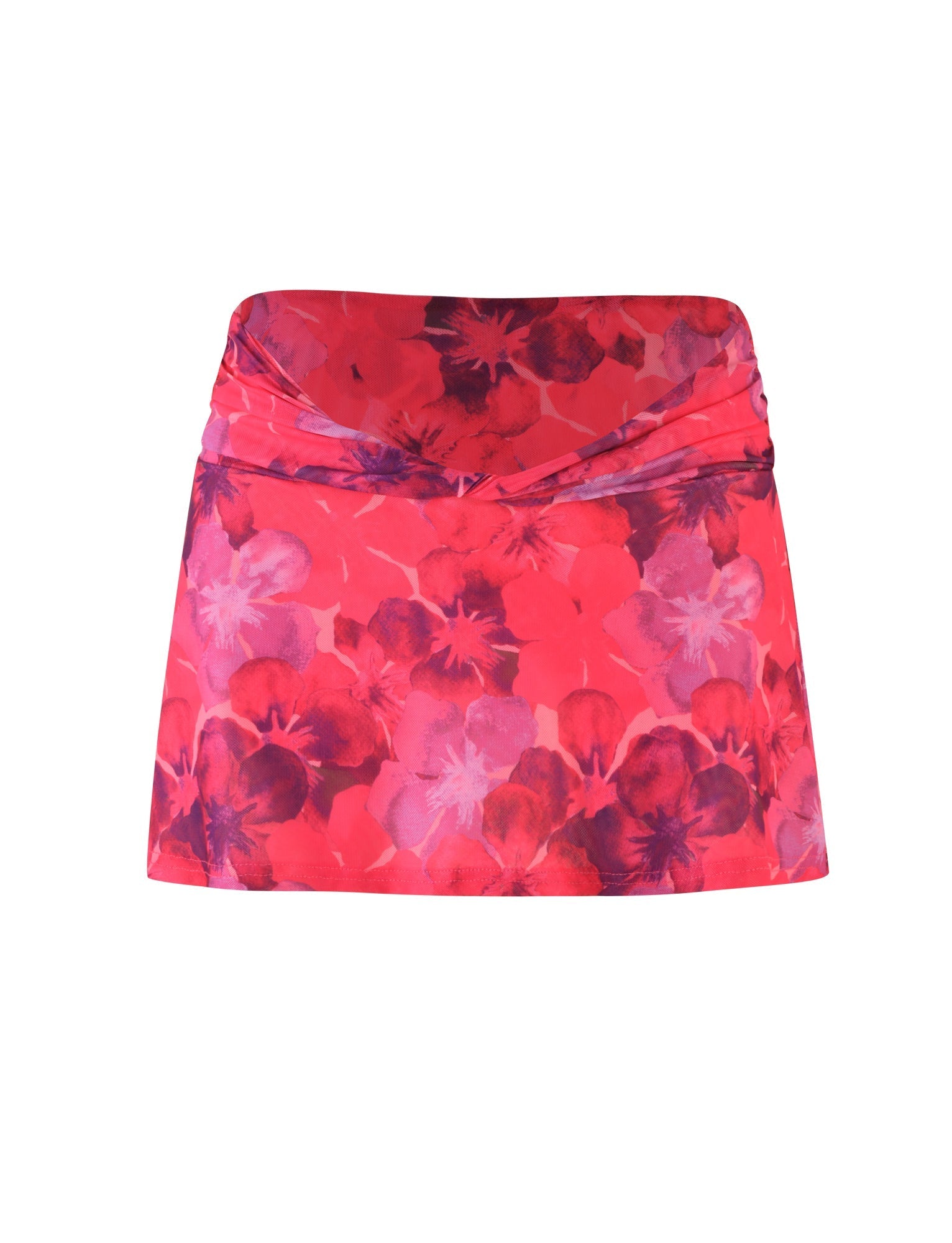 Introducing the AMETHYST SKORT - PINK : HIBISCUS by TIGERMIST, a vibrant pink floral skort characterized by a low-rise waistband with gathered fabric adorned in purple and red flower patterns. This mini-length skort boasts a chic wrap-style design at the waist, offering an elegant touch with its delicate mesh fabrication.