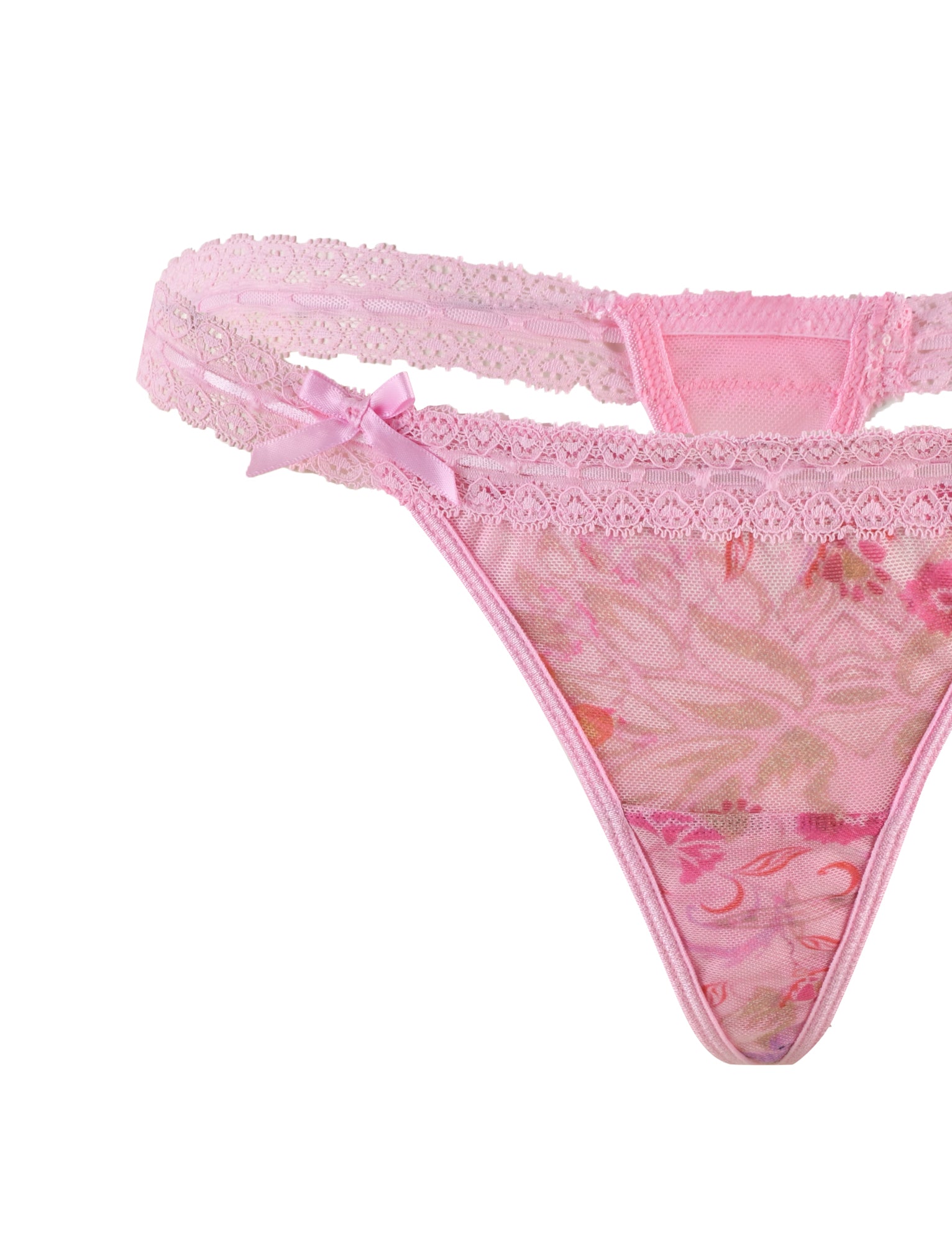 The TIGERMIST PANDORA MESH SET - PINK : DELICATE FLORAL includes a pink floral lace thong featuring a delicate lace trim and adorned with a small satin bow at the front center. Its sheer mesh design enhances its allure, while the thin, lacy waistband straps add an elegant touch.