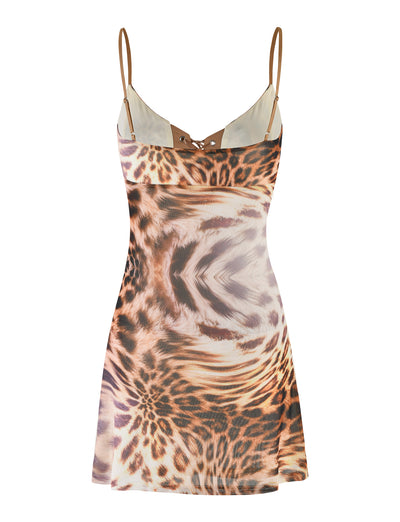 Introducing the KALILAH MINI DRESS - NEUTRAL: LEOPARD HAZE by TIGERMIST. This figure-hugging, sleeveless mini dress features adjustable spaghetti straps and a dynamic warped leopard print in shades of brown, beige, and black. The front neckline is enhanced with a small lace-up detail, adding an extra touch of style to this captivating piece.