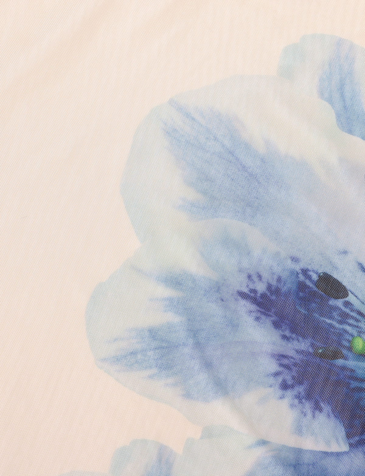 The BROOKS DRESS by TIGERMIST features a bold blue and purple watercolor-style floral print on a light beige fabric, creating a striking and elegant cream-colored look.