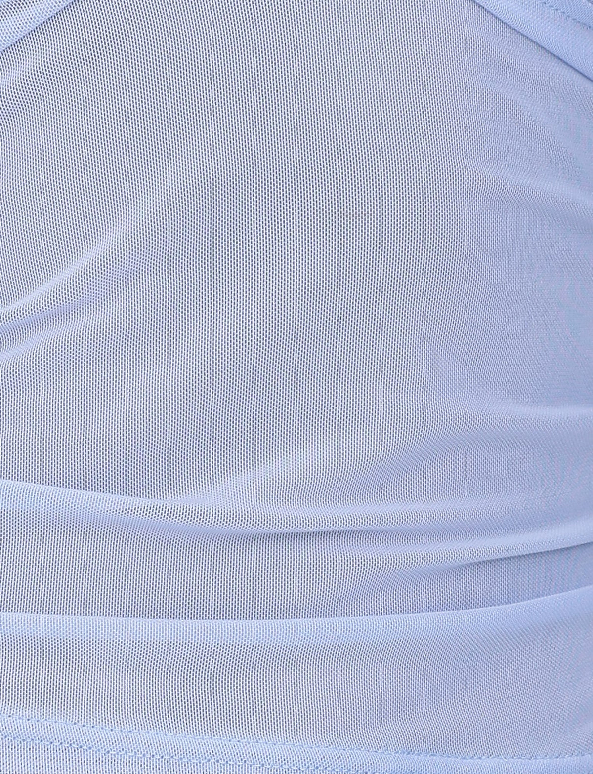 A close-up of the light blue fabric in the Steel Blue colorway, showcasing a textured, slightly sheer design with gathered layers. The fabric's gentle ripples and folds are reminiscent of TIGERMIST's elegant BRESILY TOP.