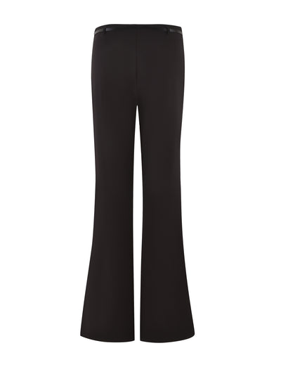 Image shows the TERLA PANT - BLACK by TIGERMIST, featuring a high-waisted, flared silhouette. These sleek suiting pants have a clean design with a slightly wider leg at the bottom, giving them a classic, retro look perfect for fashionable or professional wear.